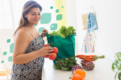 Woman preparing a healthy meal with grocery store foods. 