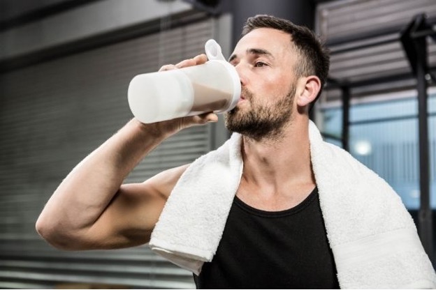 man drinking protein shake